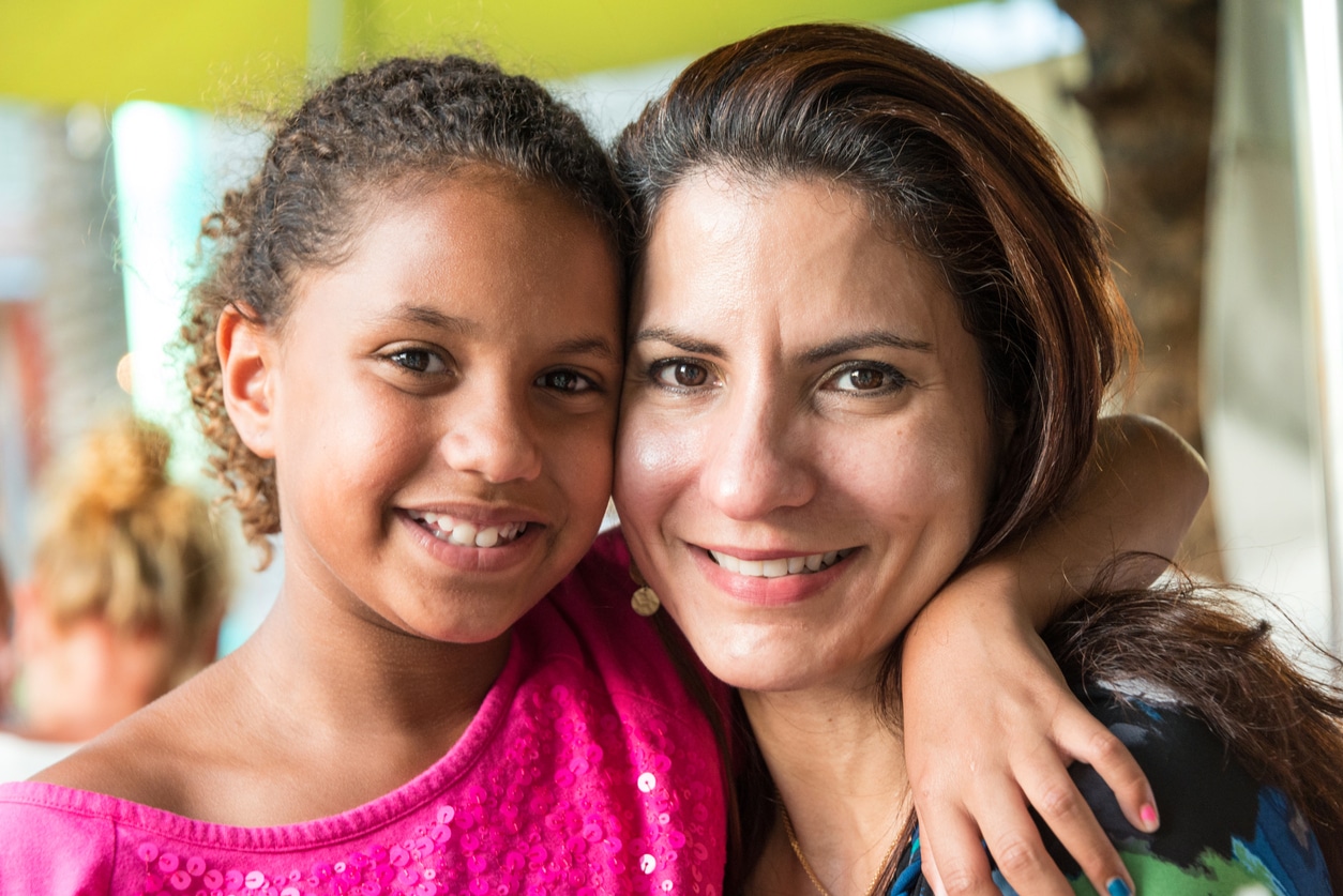 Woman fostering in Texas smiling with foster daughter